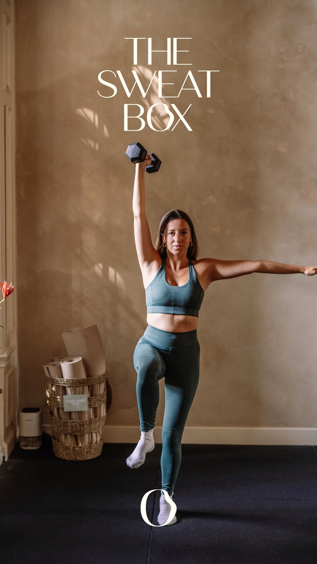 A serene spa setting with two lounge chairs beside a warm, reflective pool and soft, natural lighting.
