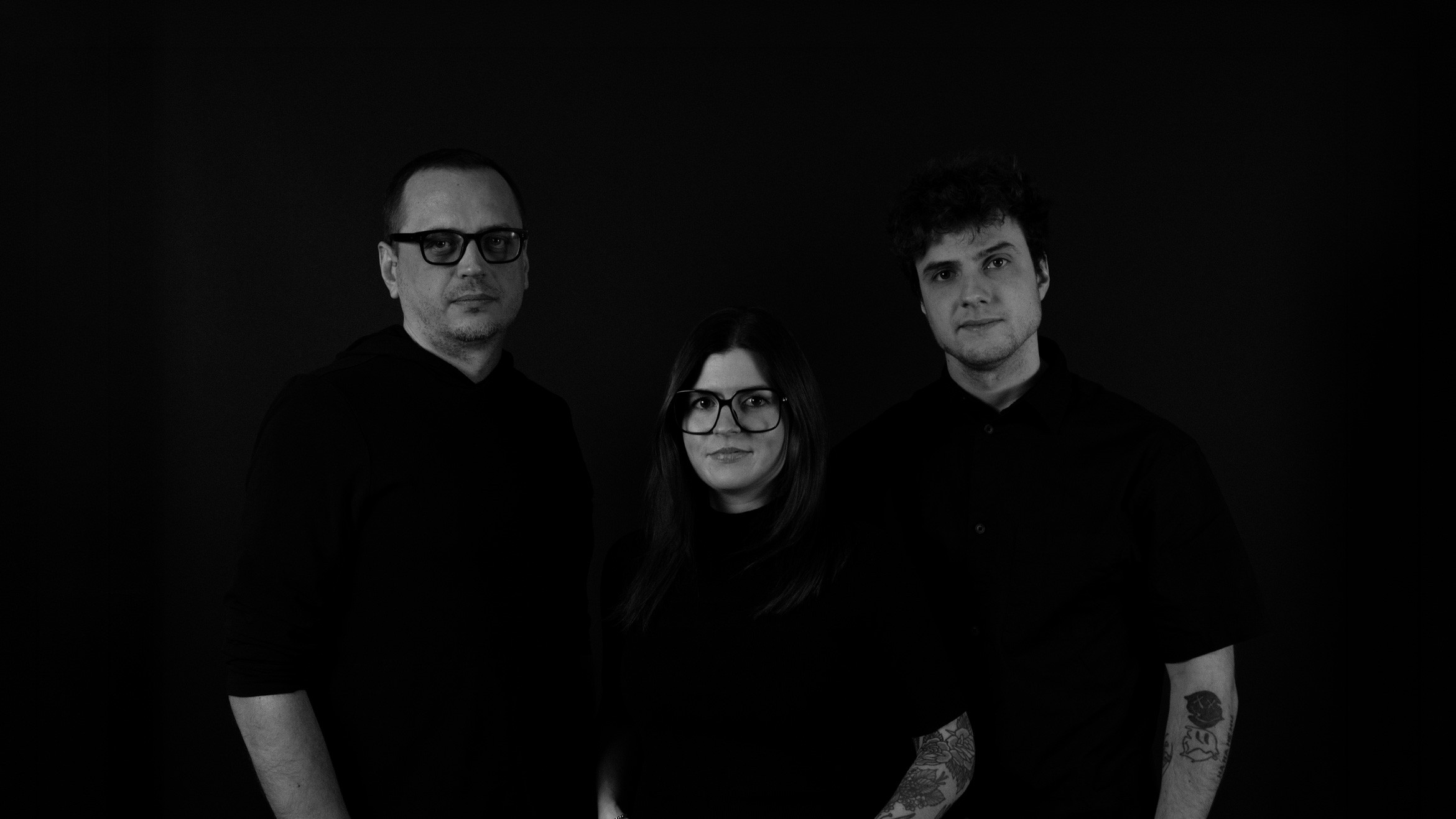 People celebrating, red stickers floating in the air