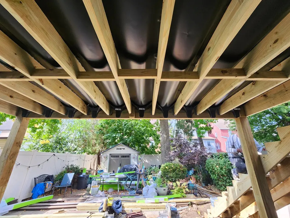 Luxury Trex composite deck stairs with picture framing, recessed lighting, and Transcend railings in Queens, NYC