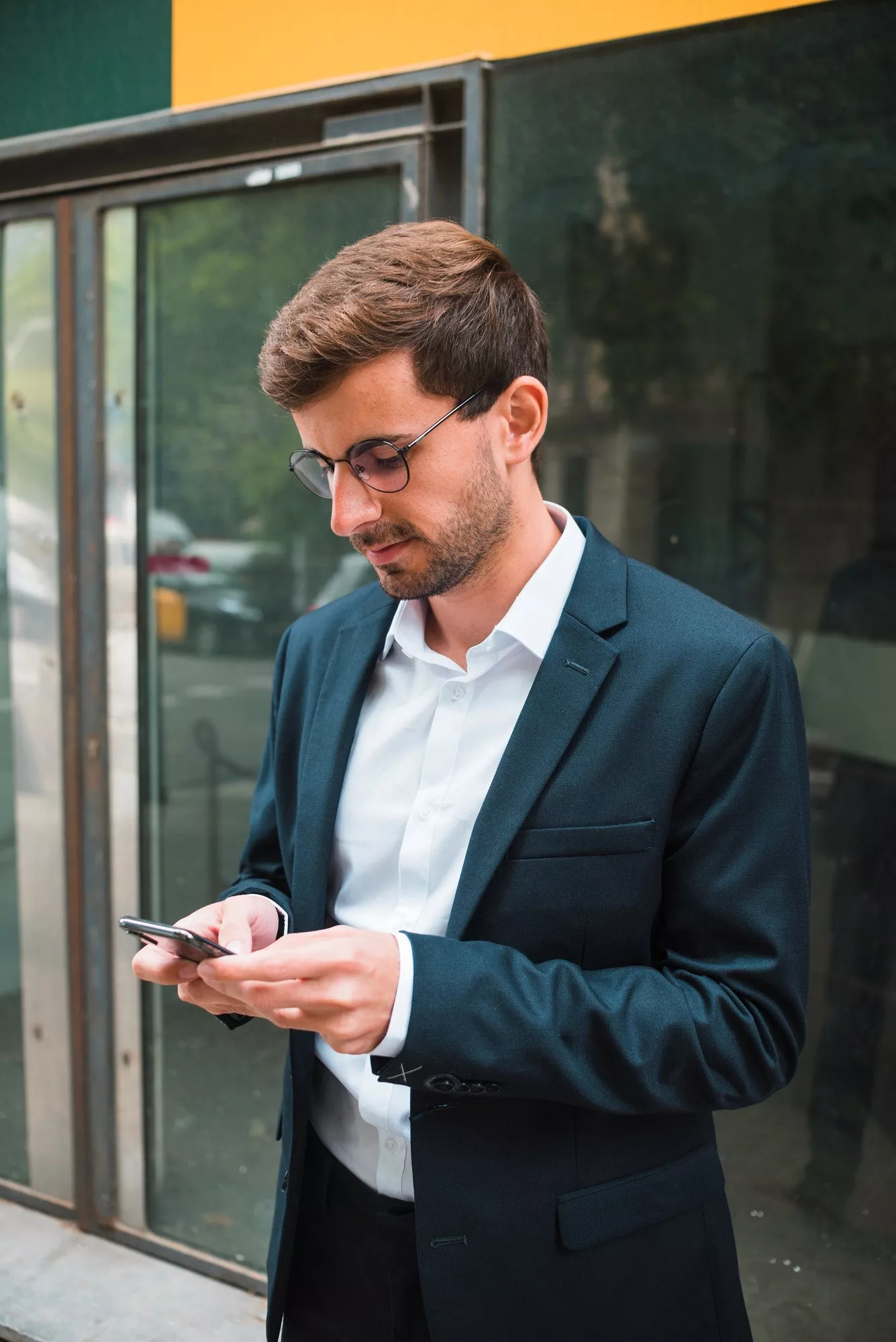 Businessman is Looking at his mobile phone