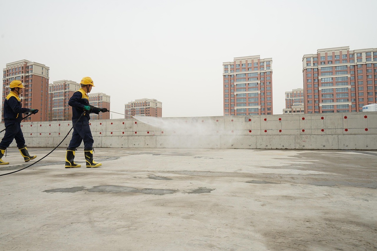Workers working on waterproofing solutions