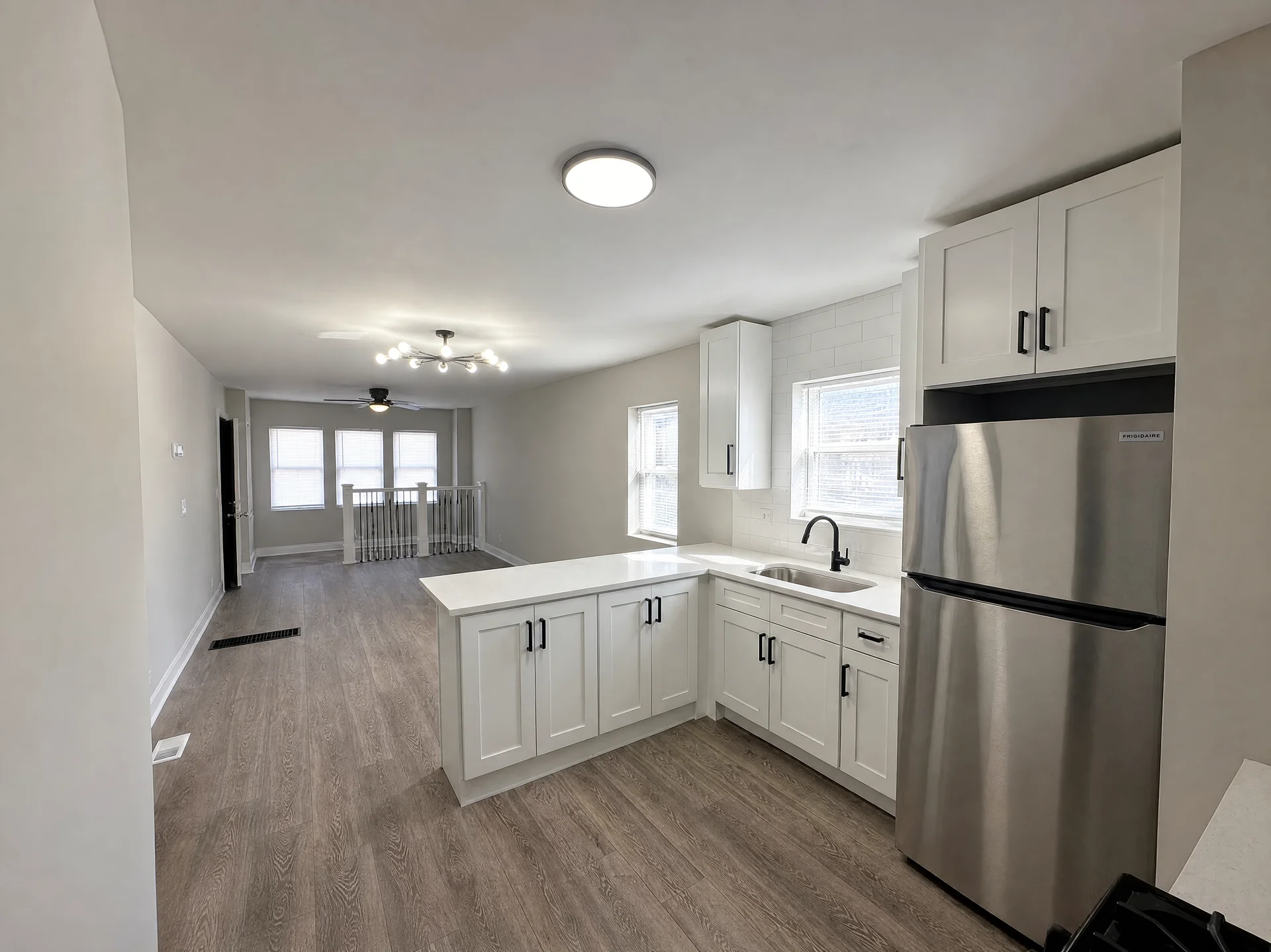 Clean empty room with gleaming hardwood floors after Simple Scrub move-in move-out cleaning