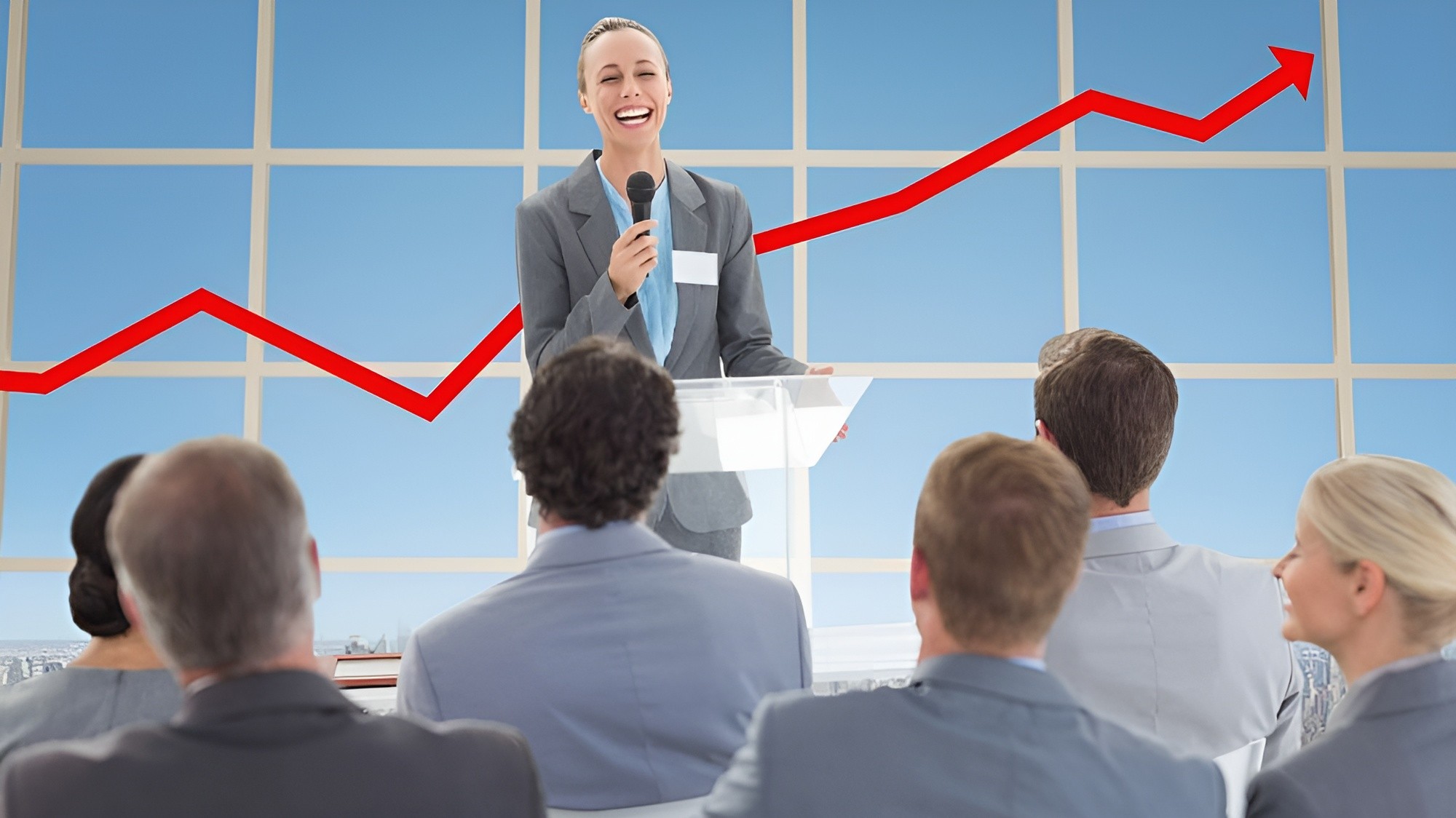 Business speaker presenting an upward growth chart