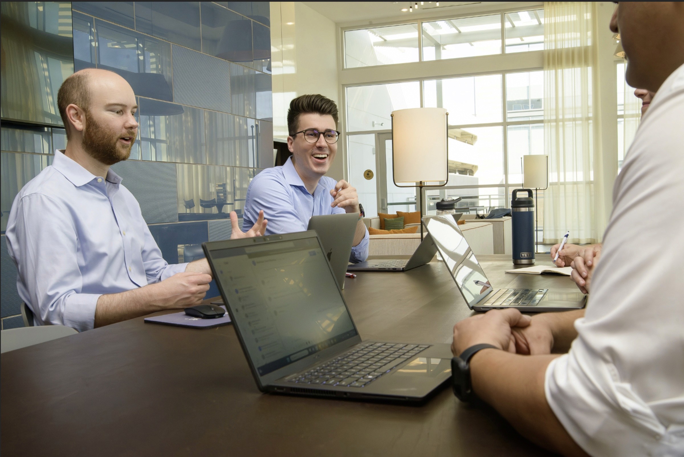 Team members collaborating around a conference table