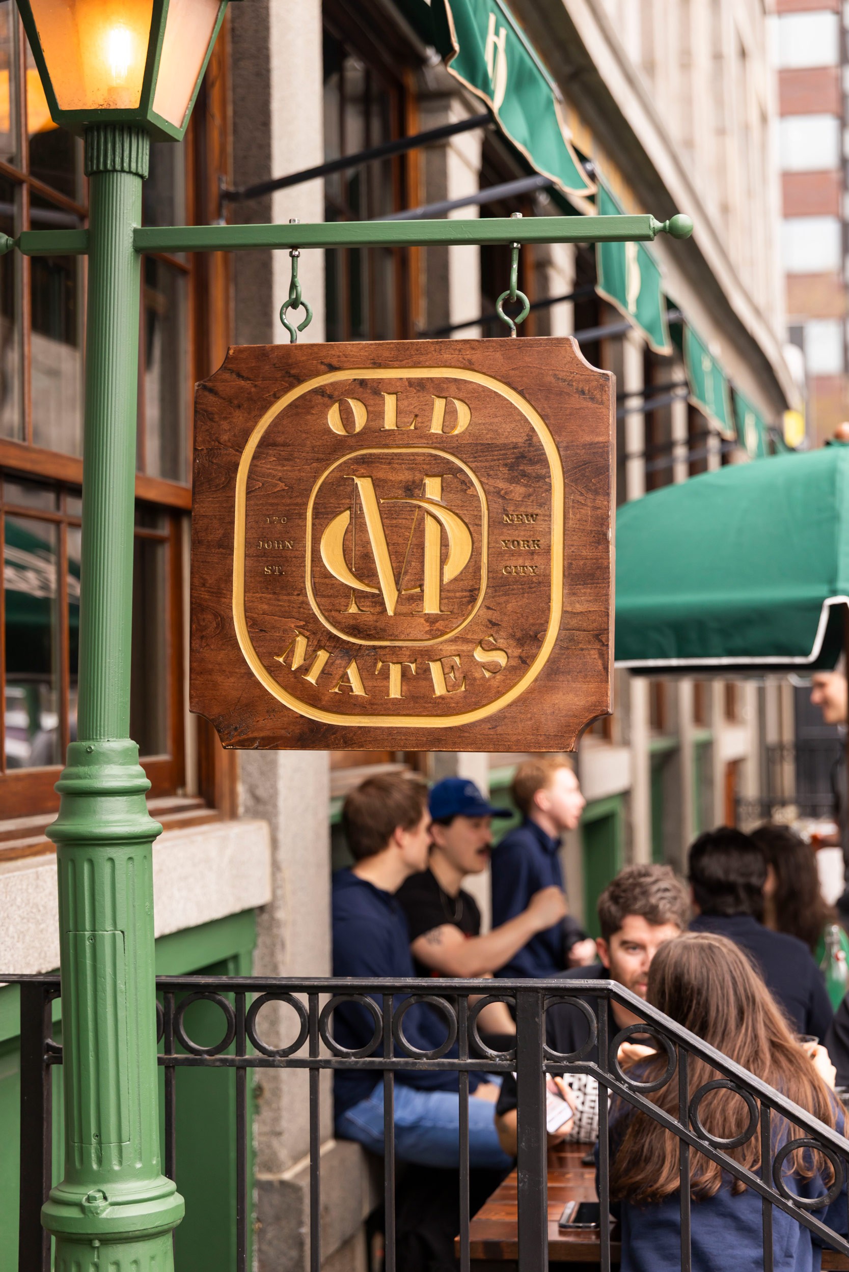 Old Mates Australian pub branding, exterior signage and collateral at the Seaport location.
