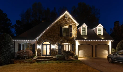 Custom residential outdoor lighting on a large two-story home in Chester County, PA, featuring roofline lights.