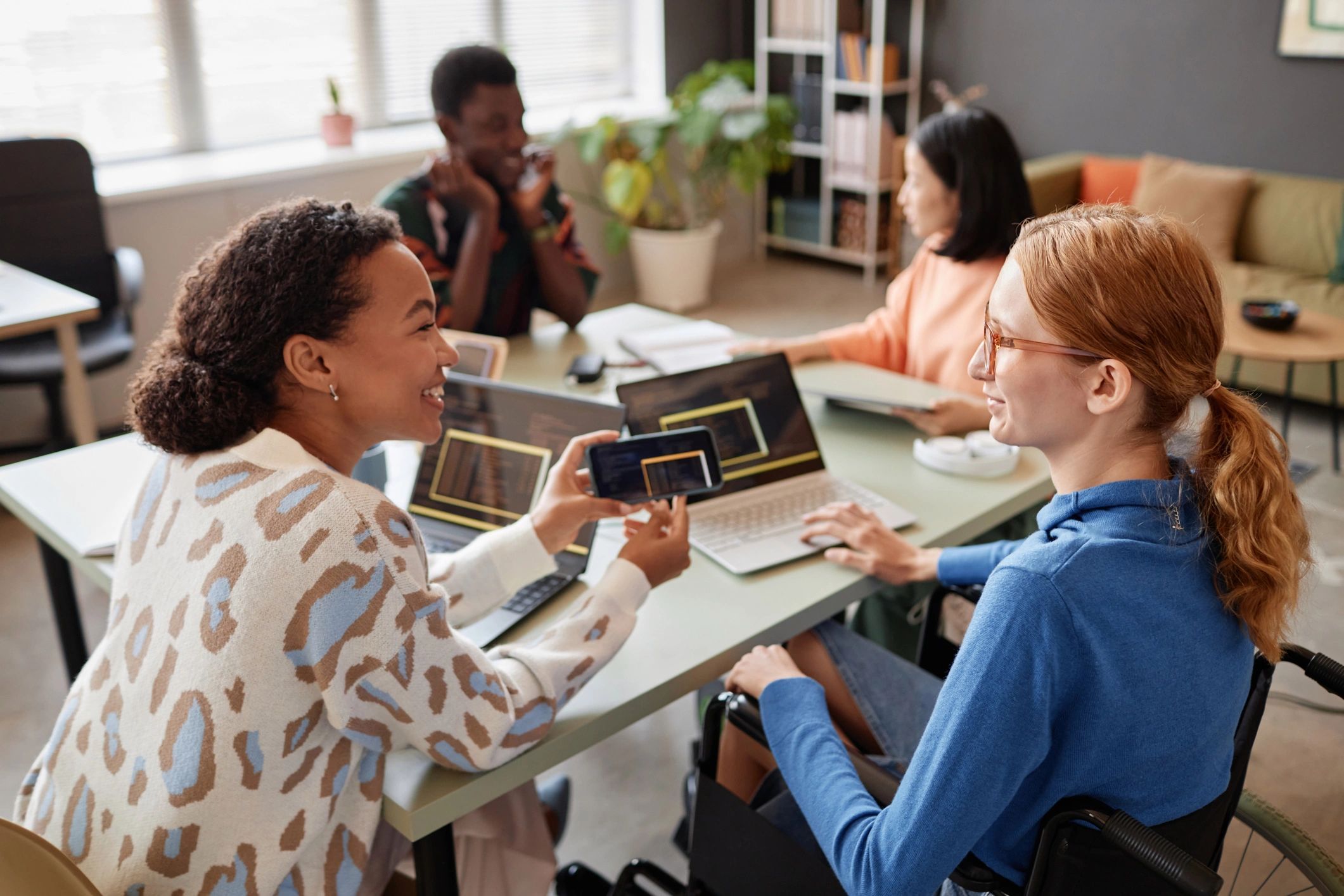 a black and white living room with a large tv