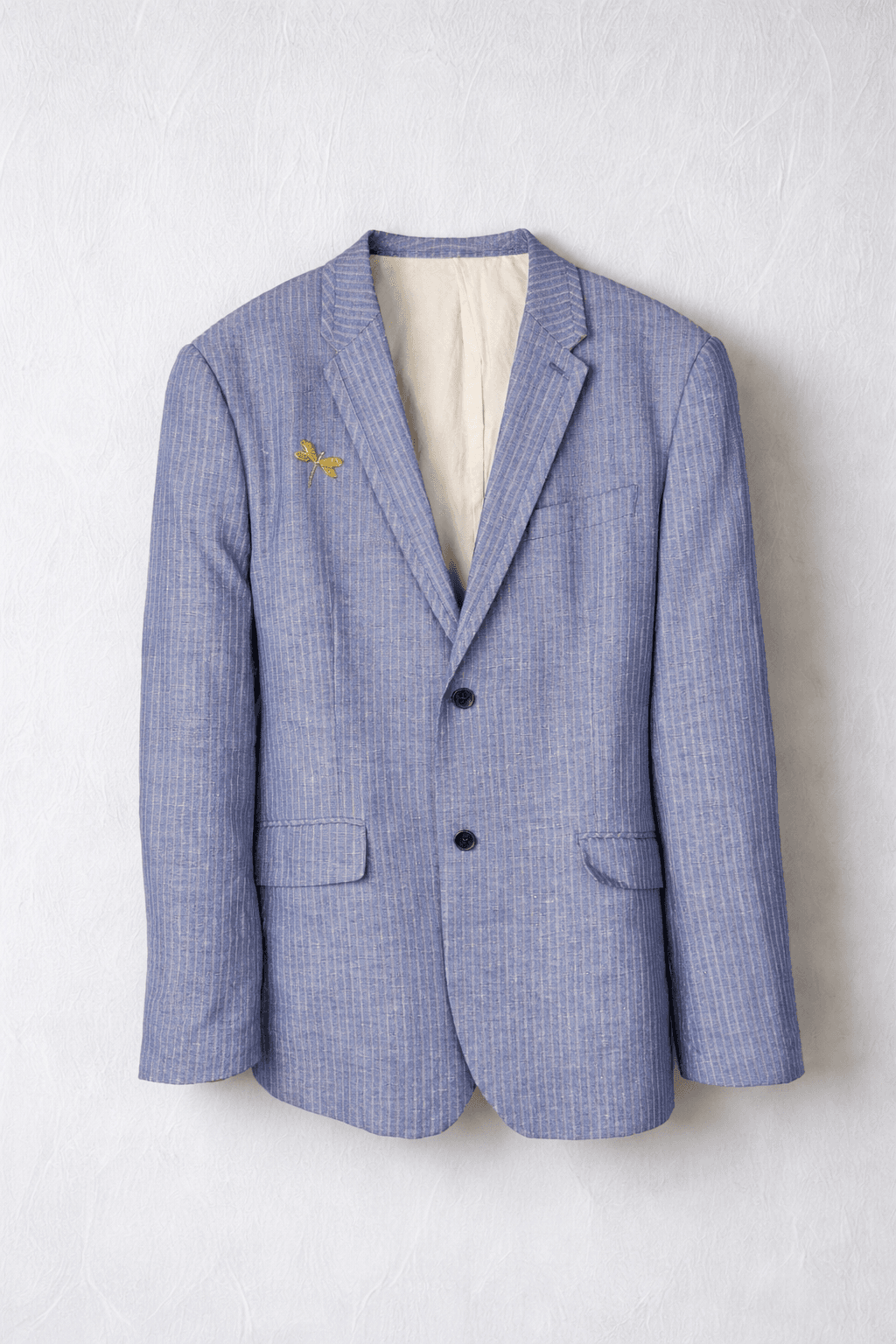 Blue striped men's blazer with dragonfly pin
