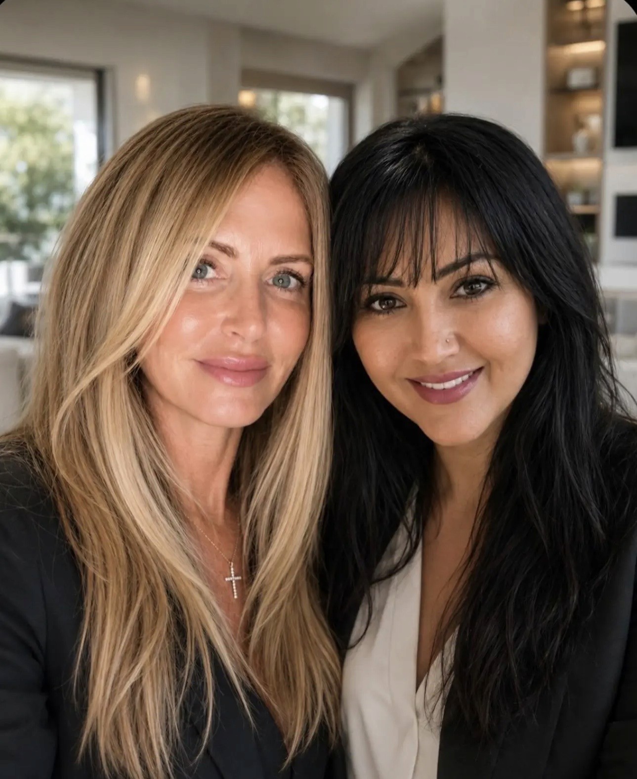 Professional photo of two women business partners in dark blazers