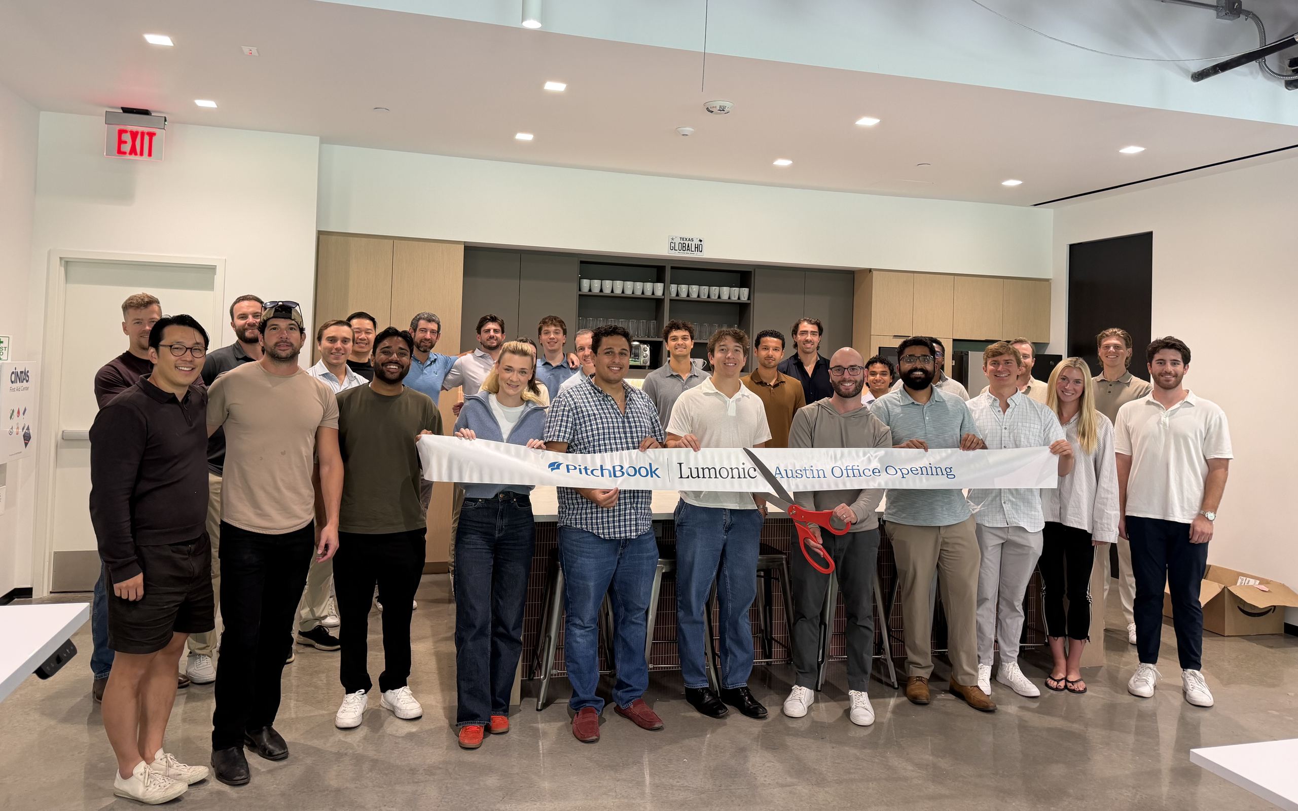 The Lumonic team cutting the ribbon at the new Austin office