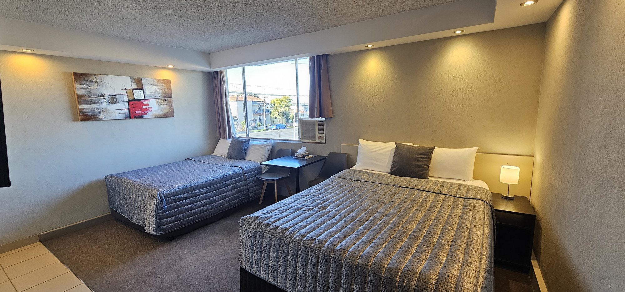Family Studio at Parkville Place with a queen bed and second bed by the window