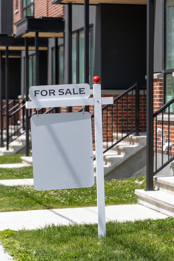 person writing on white form paper