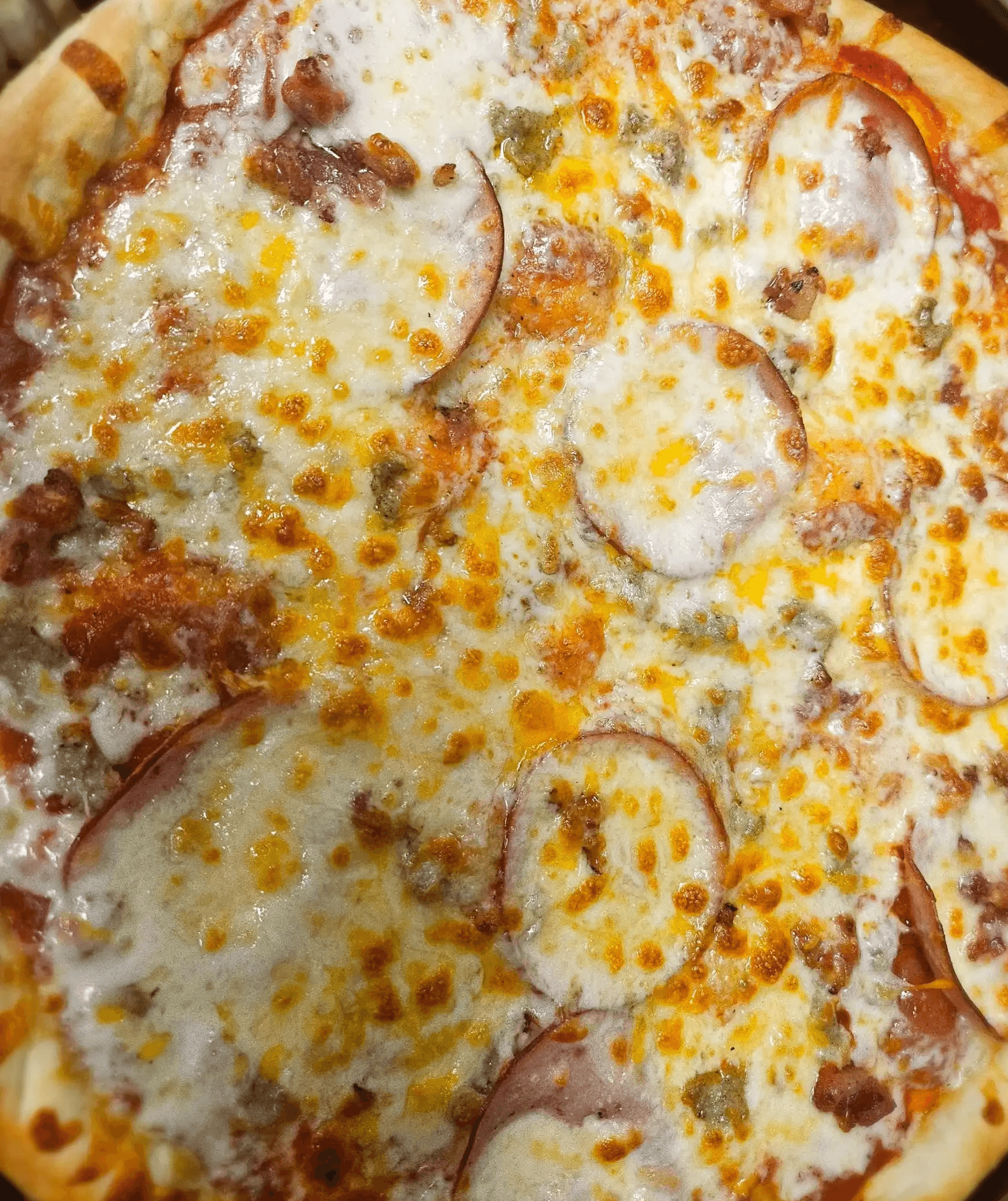 Blunderbuss (All Meat)  Three cheese blends. Pepperoni, Italian sausage, bacon pieces, and Canadian bacon.