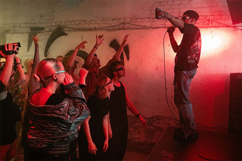 Edgar Vunš (Mr Maze) performs in a lively bar scene from Rolling Papers (Pikad paberid) as the crowd dances and celebrates the night