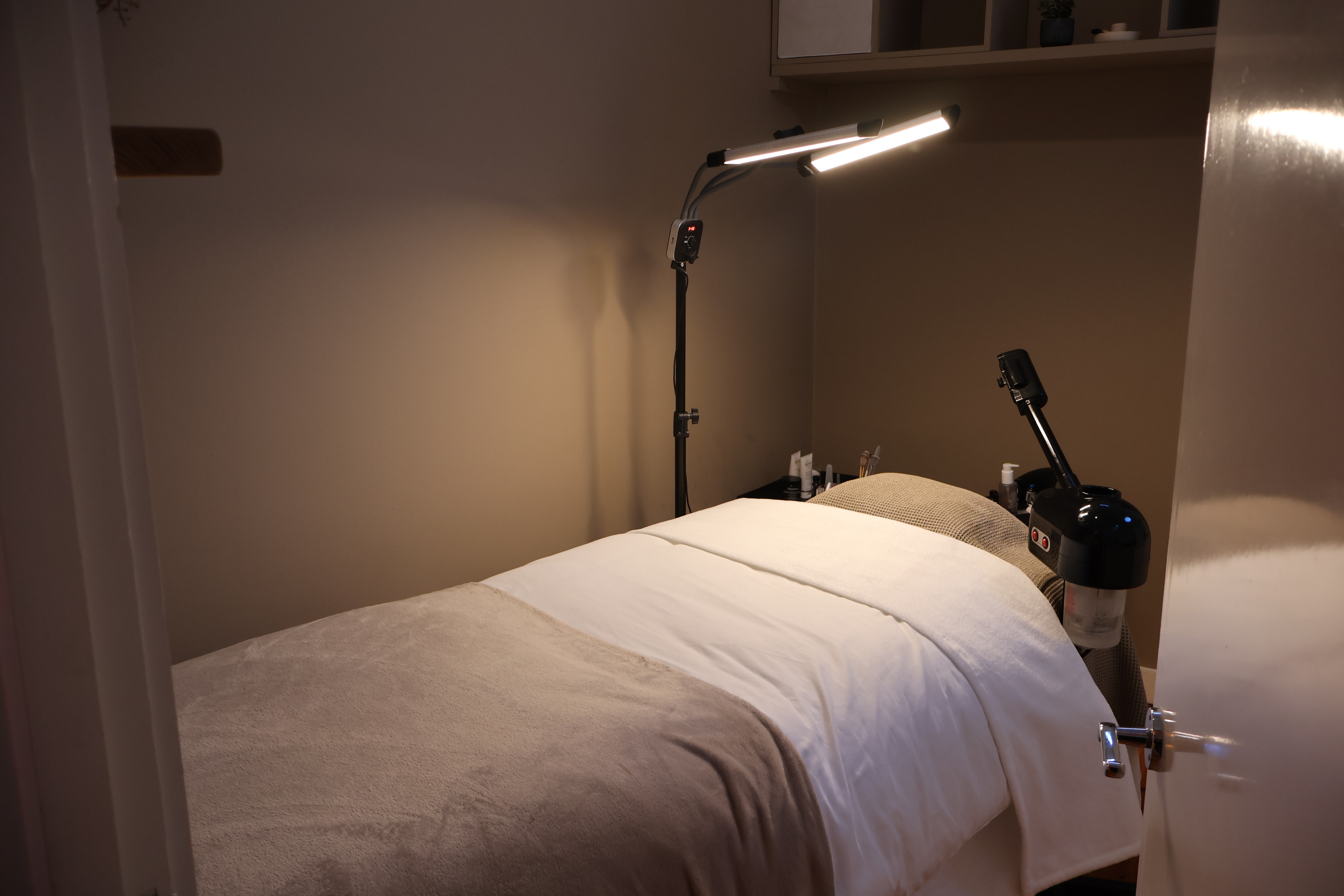 Rachel, personal trainer, looking to the side confidently in a fitness studio