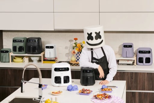 MrBeast, a young man with short hair wearing a black t-shirt, looking thoughtfully to the side against a gray background.