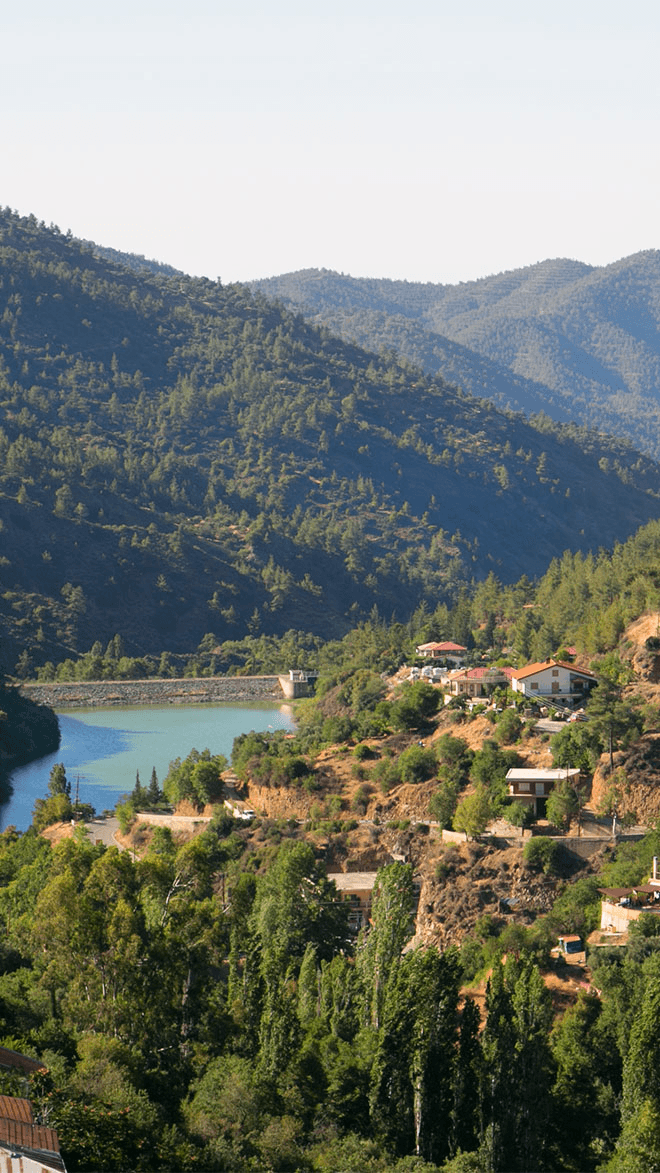 Mountain landscape with lake and houses on the hillside