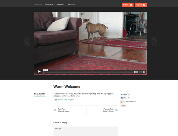 A screenshot displays a webpage titled “Warm Welcome,” featuring a video thumbnail of a dog standing on a red rug in a living room. The video is paused at 00:04. Below the video are navigation links for “Next Post,” “Previous Post,” and “Baker’s Dozen,” along with a “Recommend this” button and a “Leave a Reply” section. The date “March 25, 2012,” and language “English,” along with a “Greeting” tag, are also visible.