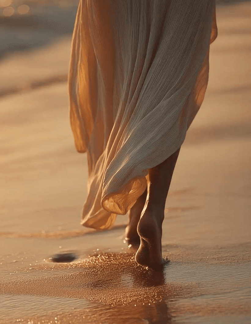 A circle of people sitting cross-legged, meditating with hands in a prayer position. Soft, warm lighting.