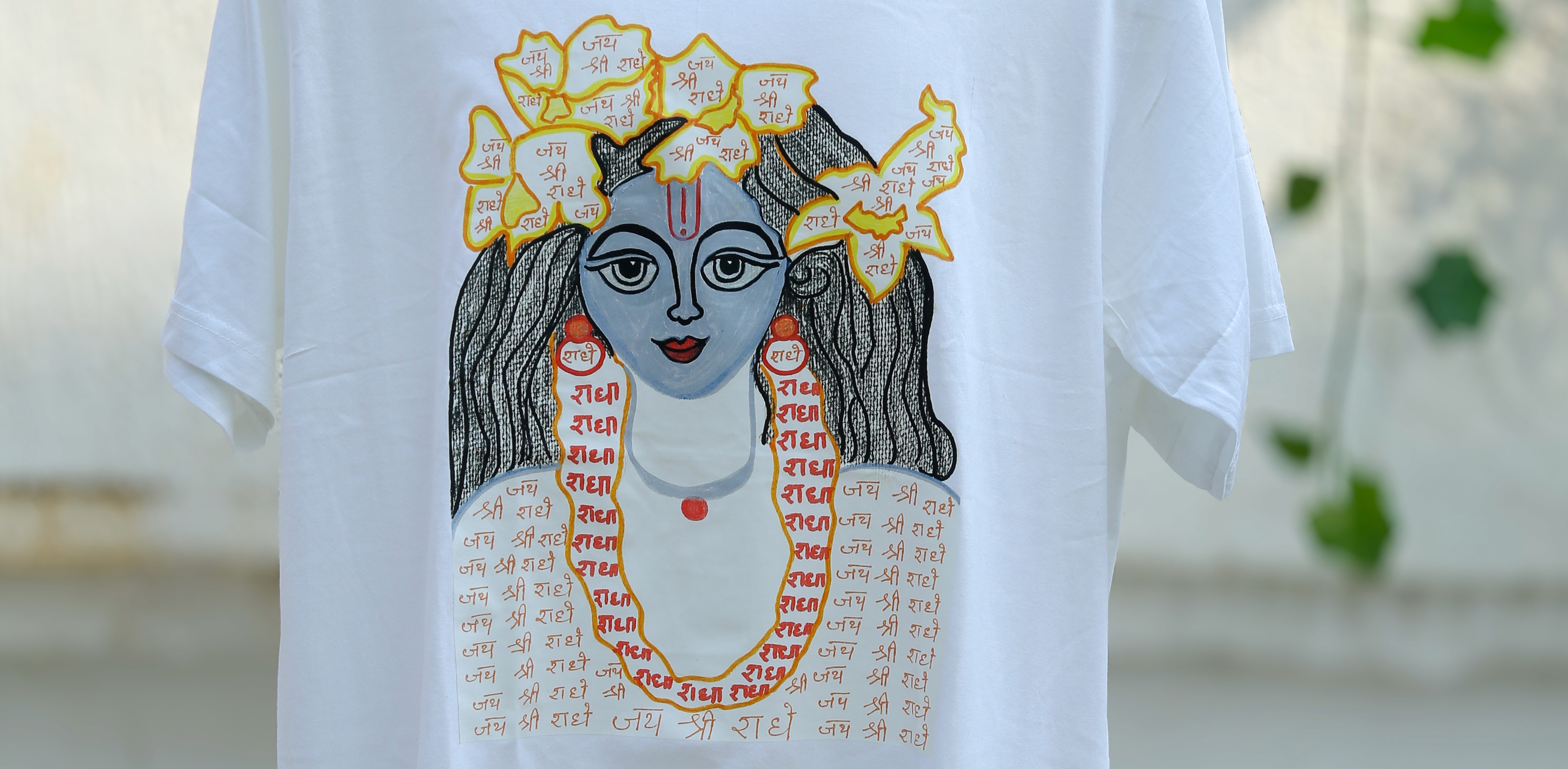 Young man in black leather double-breasted jacket jeans looking at the bottom