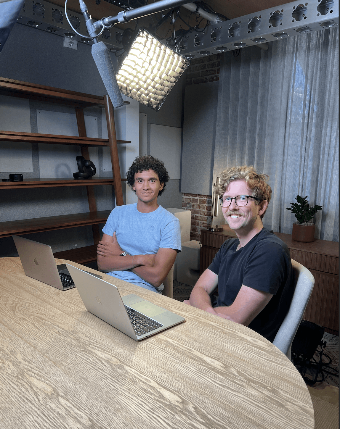Mecone founders outside the a16z office beneath the a16z sign