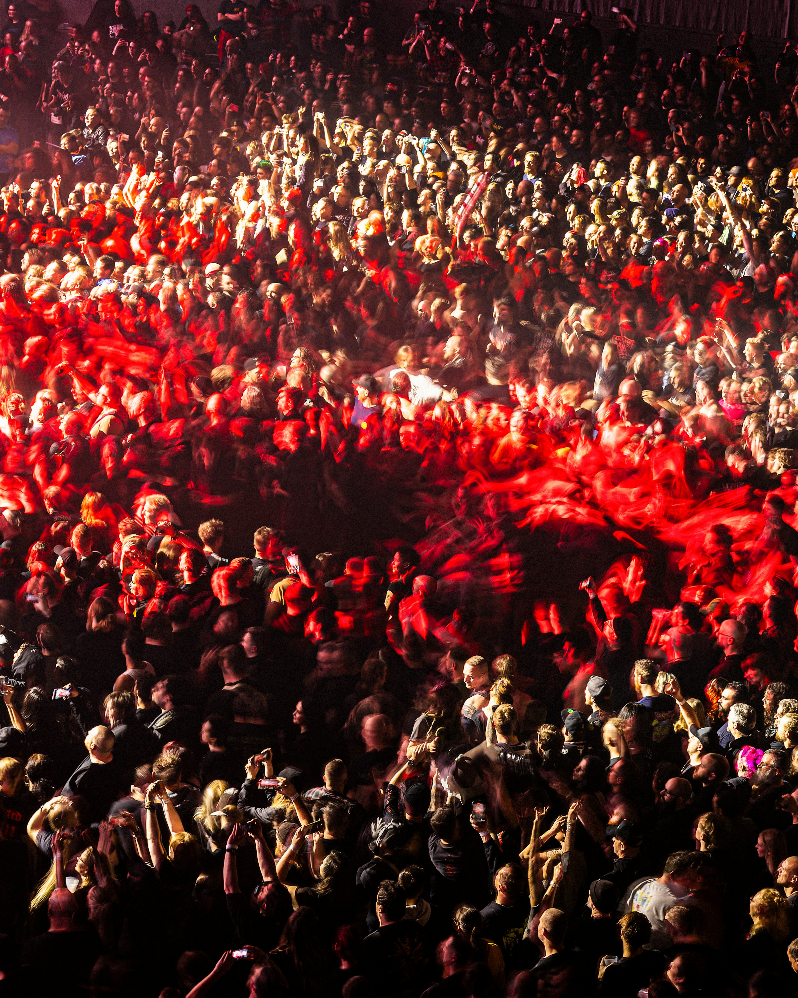 A large crowd of people standing around a stage