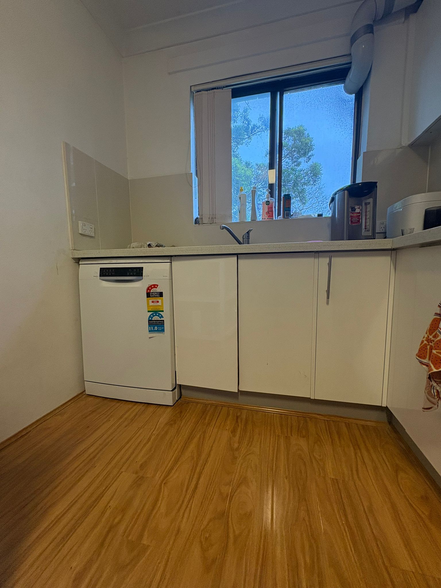 white wooden kitchen cabinet and white kitchen counter