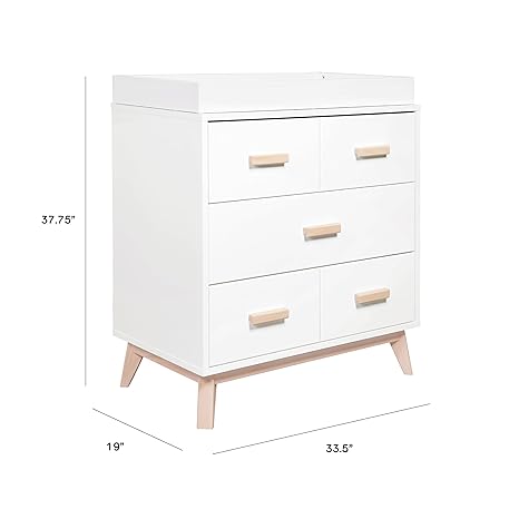 Elegant babyletto scoot dresser with ample storage space and a timeless design.