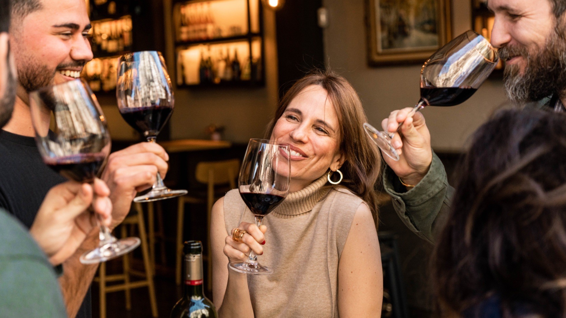 Small group enjoying a wine tasting experience during a Barcelona food and wine tour.
