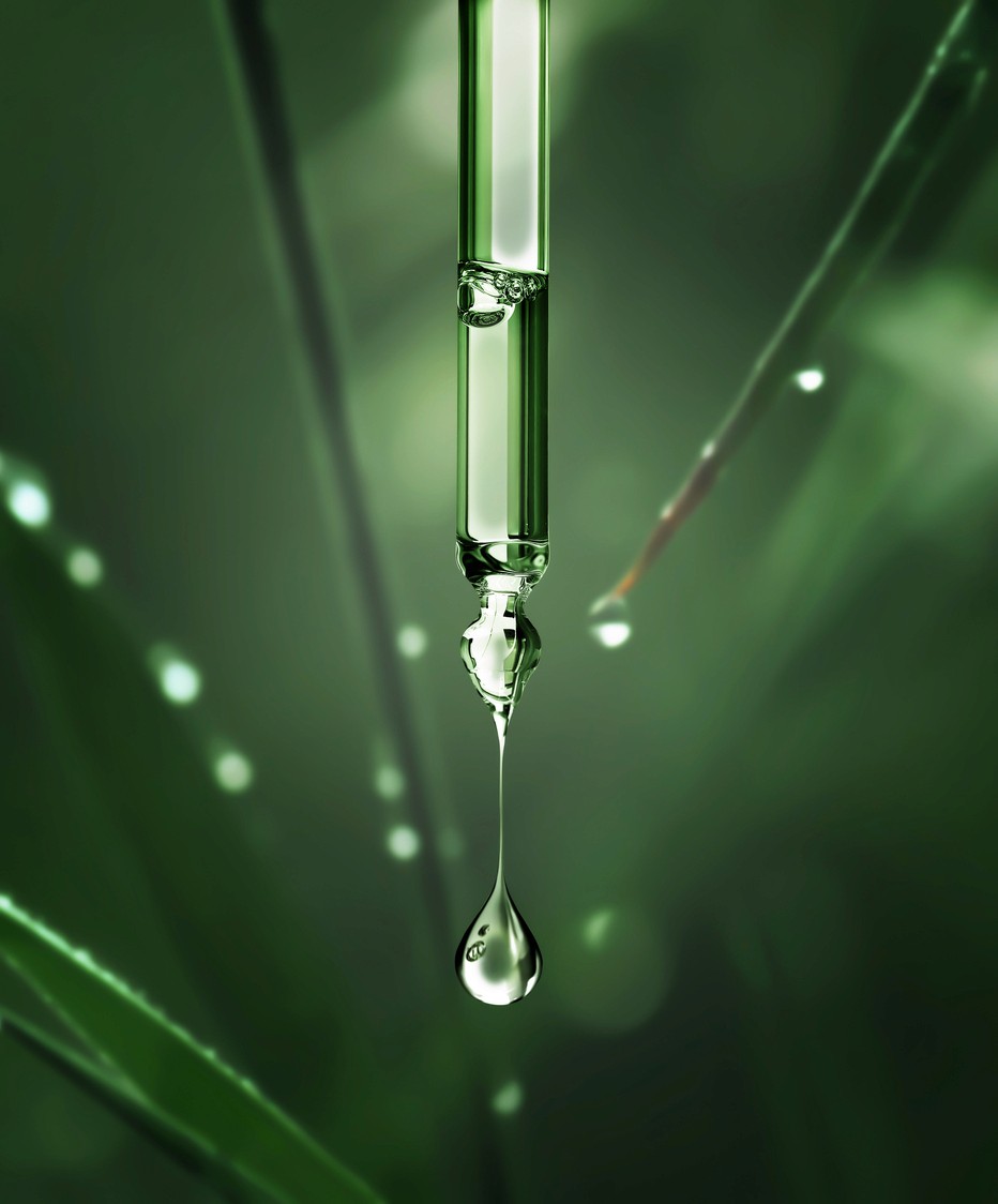 A close up of a medicine dropping actively dropping liquid