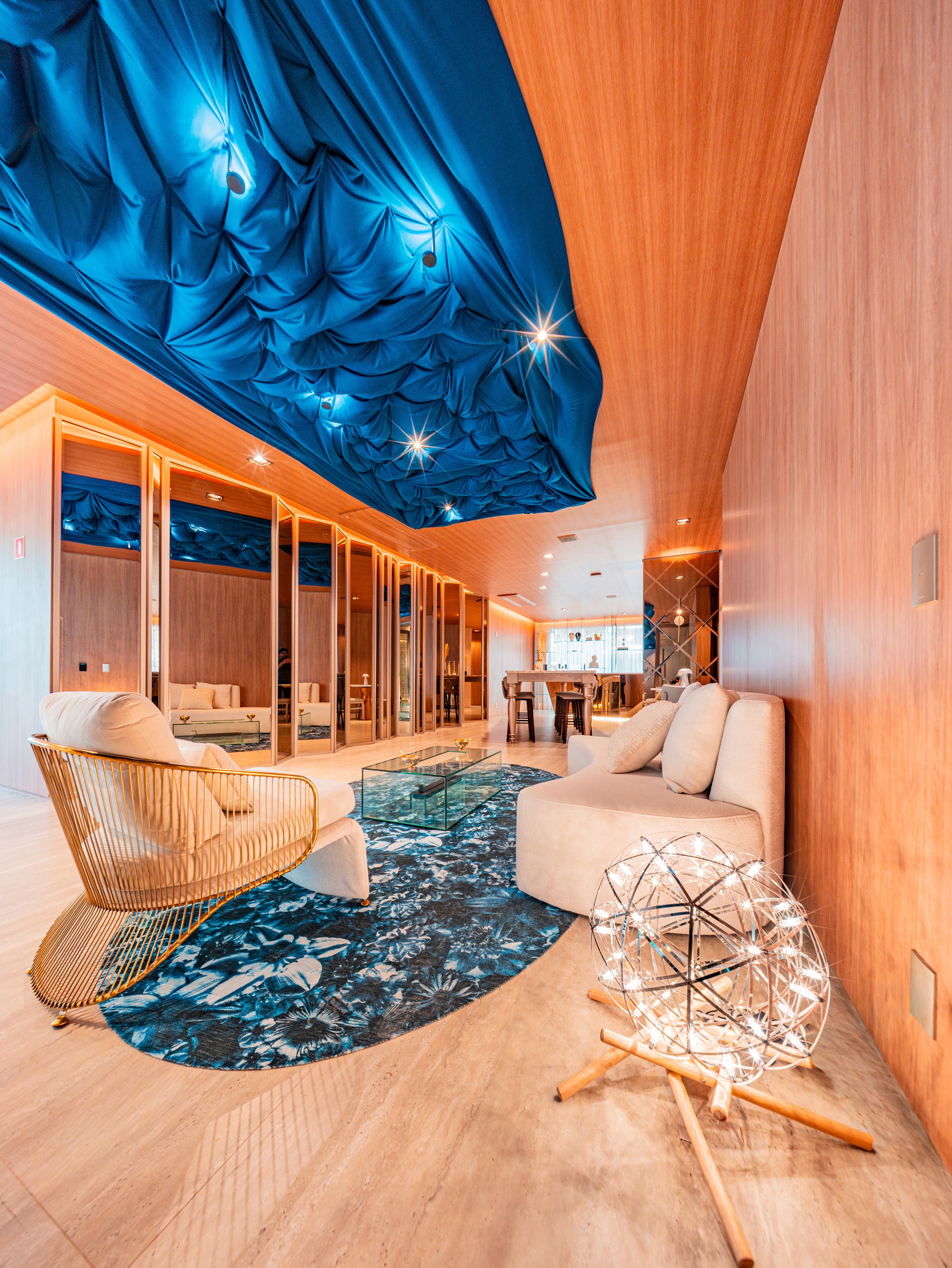 Curved modern skyscraper against a clear blue sky.