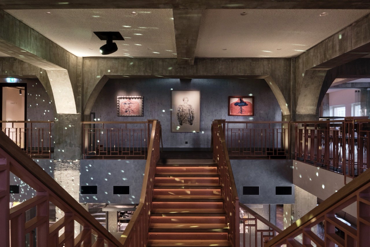 Art-lined corridor and staircase inside Capital C, the Amsterdam cultural hub that is home to Capital Kitchen.