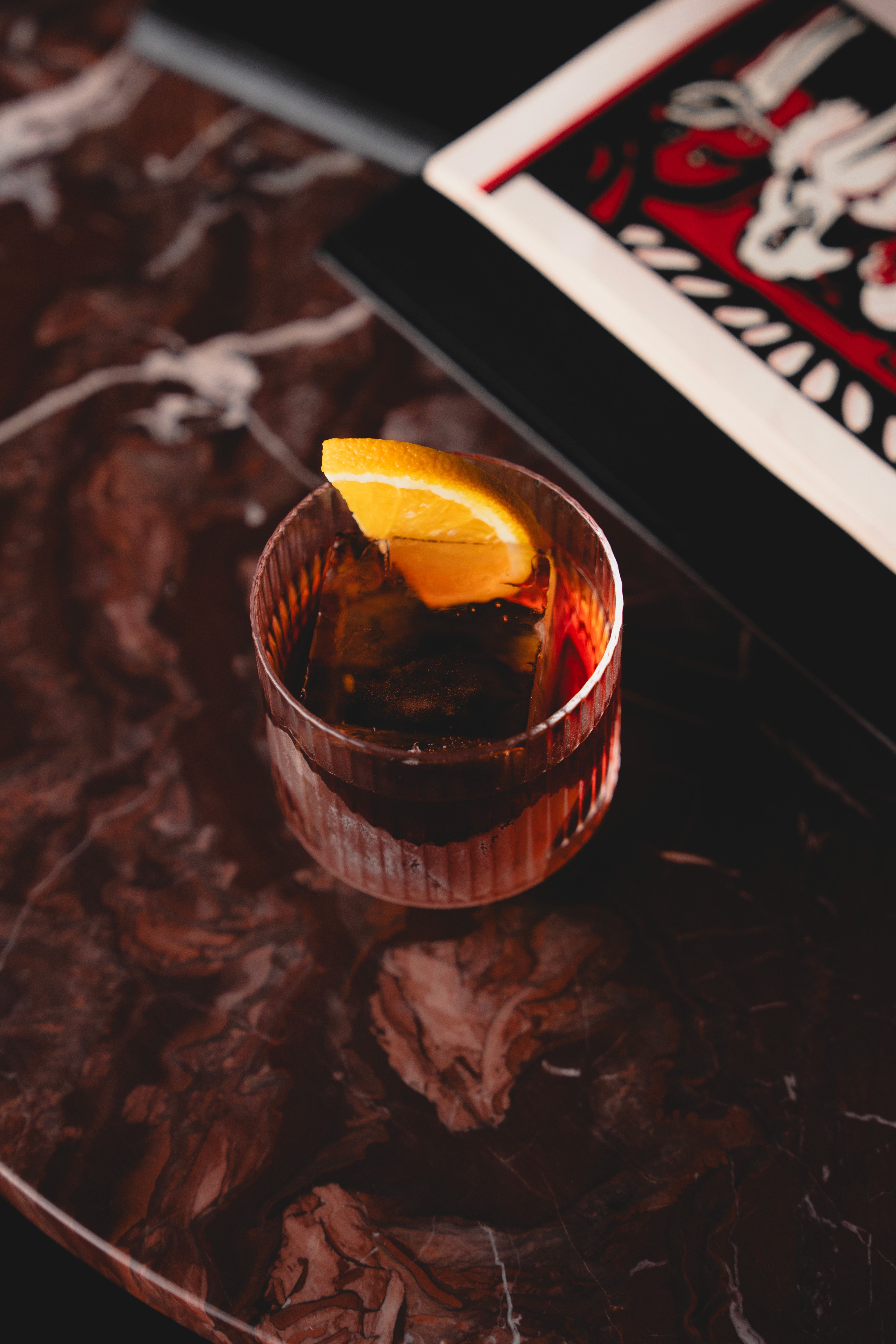 Bottles of olive standing on the marble counter
