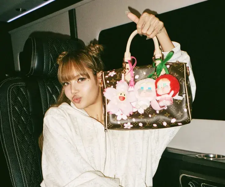 Lisa from Blackpink with her Labubu
