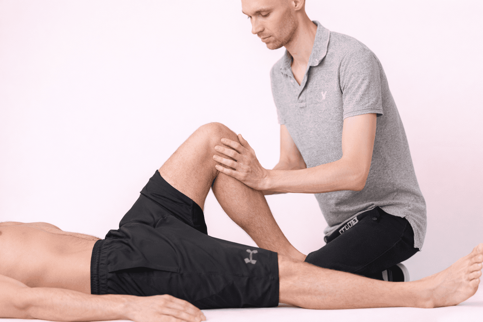 a man getting his leg examined by a doctor