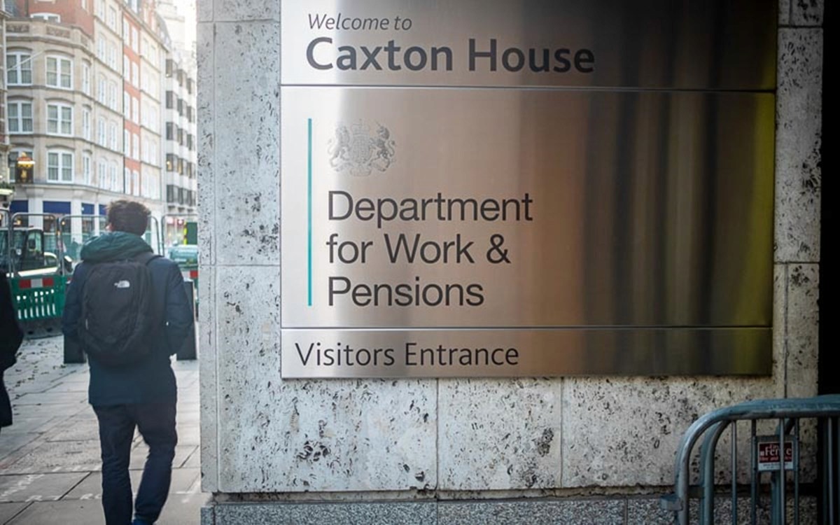 Photo taken outside of Caxon House the HQ of DWP the photo shows the sign on the building that reads 'Welcome to Caxton House, Department for Work & Pensions, Visitors enterence