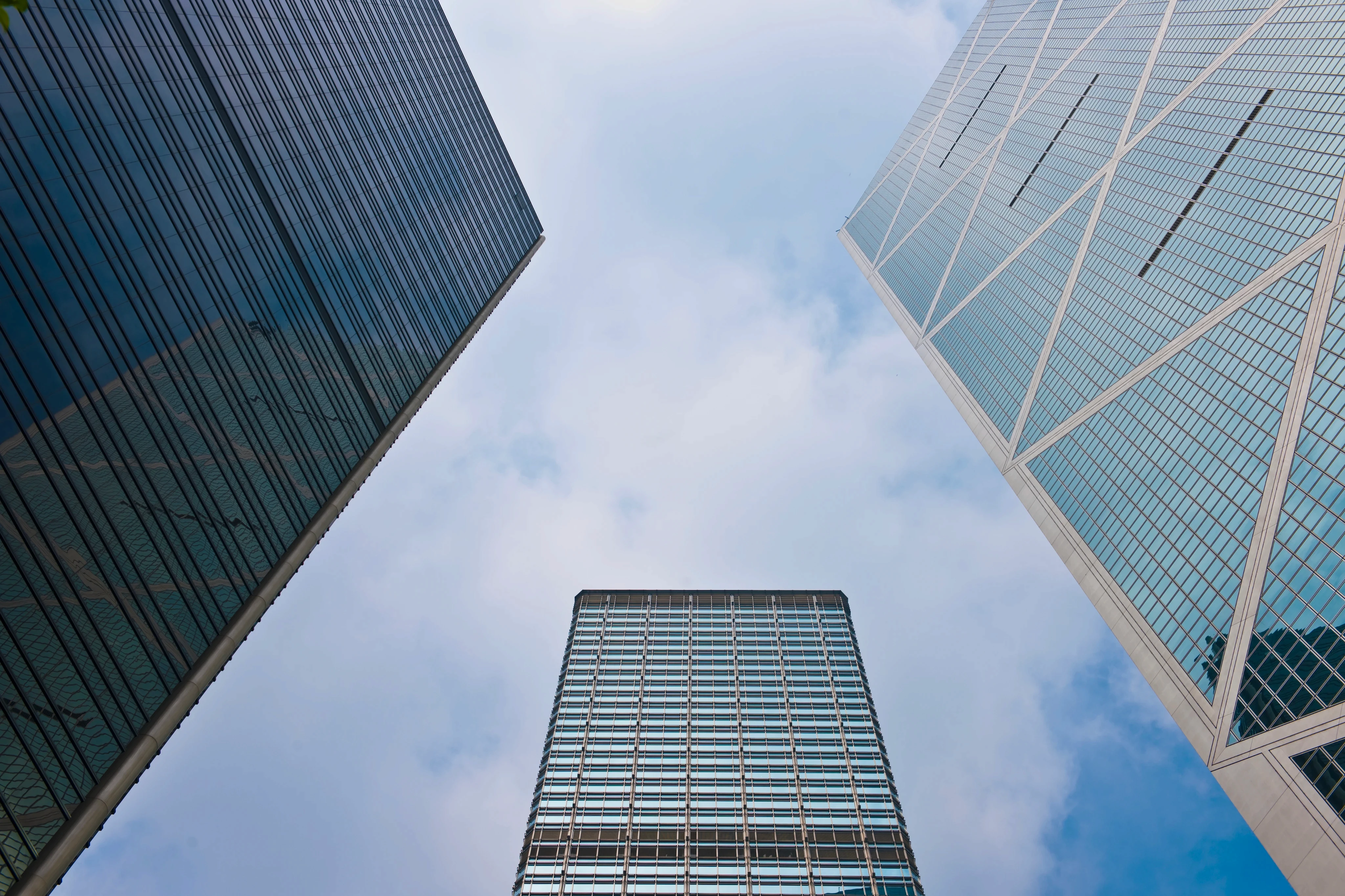 A low-angle photograph of buildings in a large city.