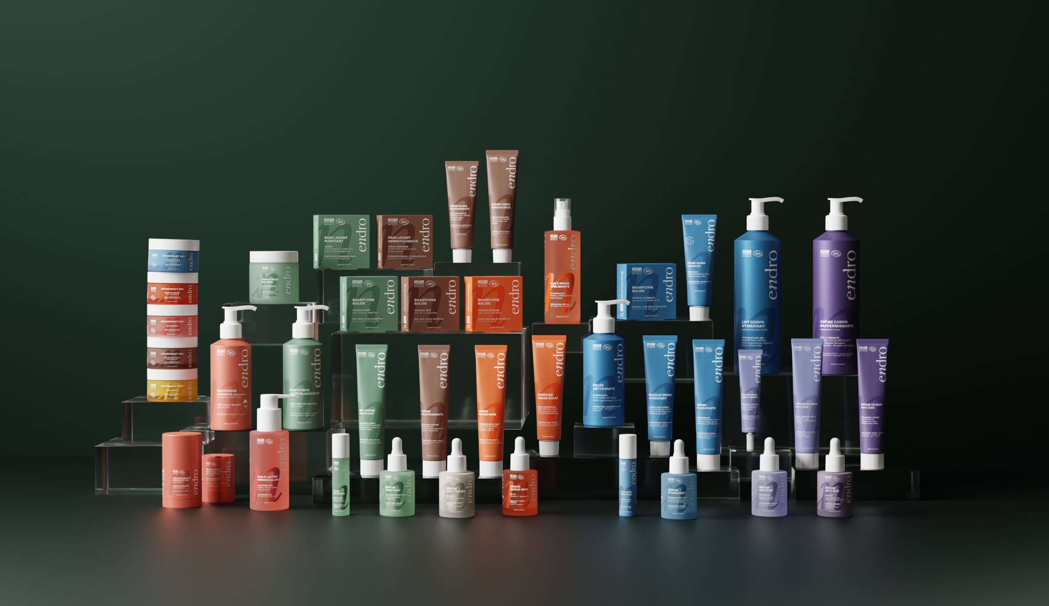 3D product visualization of cosmetics product catalog. Stacked in rows, dark green background.