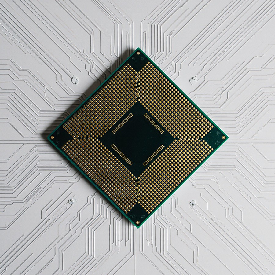 Minimalist brushed-steel chair in a white corner studio—industrial, brutalist modern furniture.