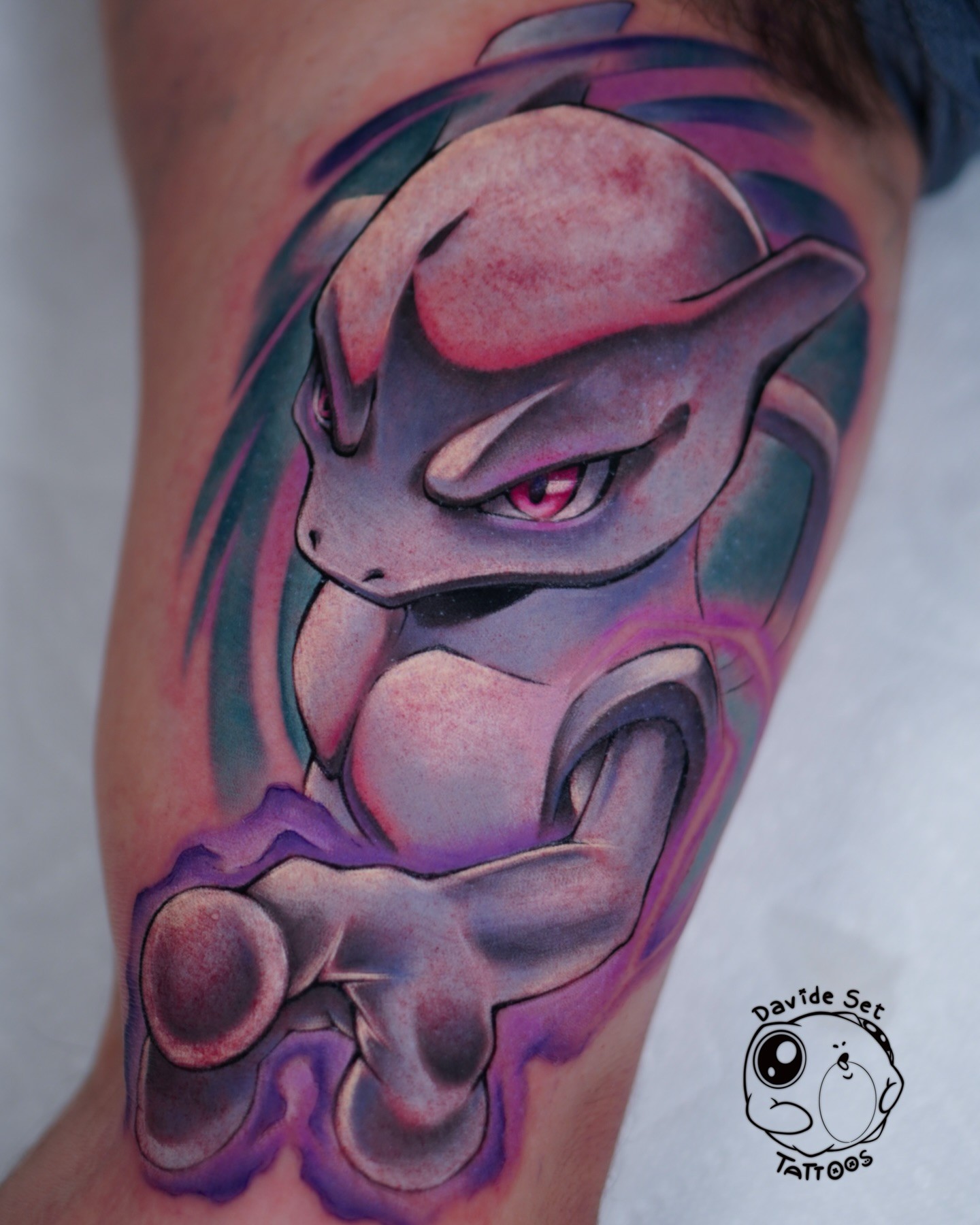 colorful anime tattoo of the pokemon mewtwo