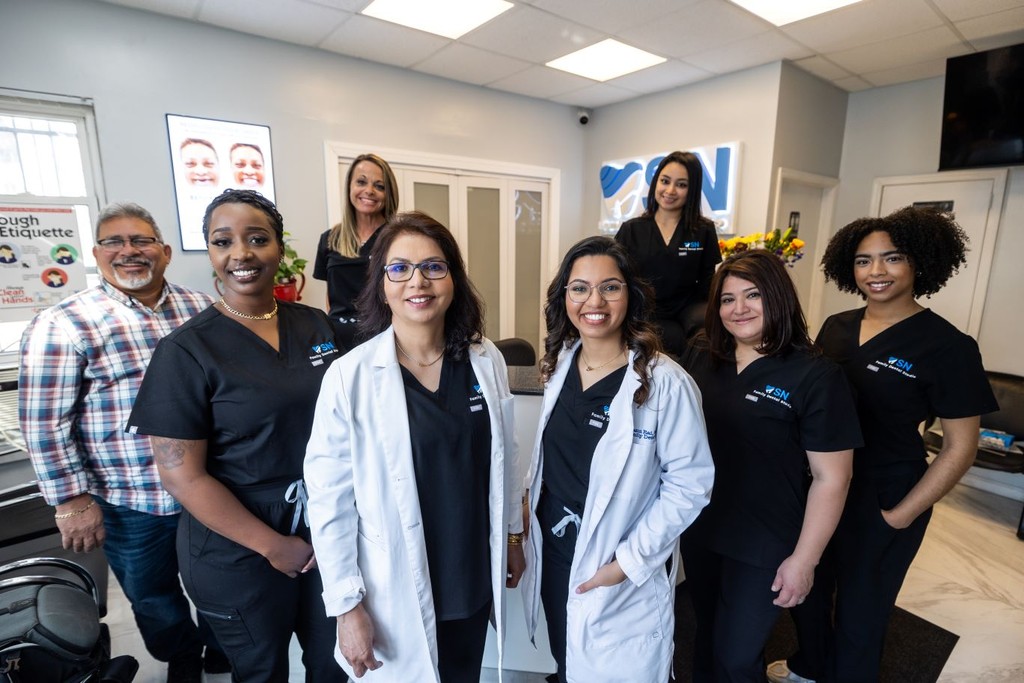 Dentist team smiling in dental office Newark & Milltown NJ