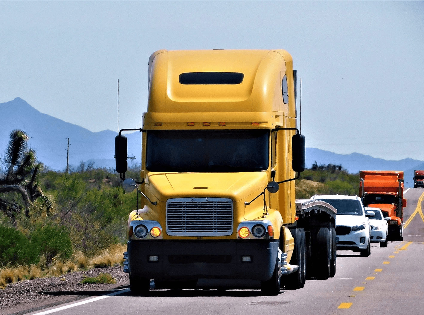 Big rig on the road illustrating legal help for Stockton truck accident victims