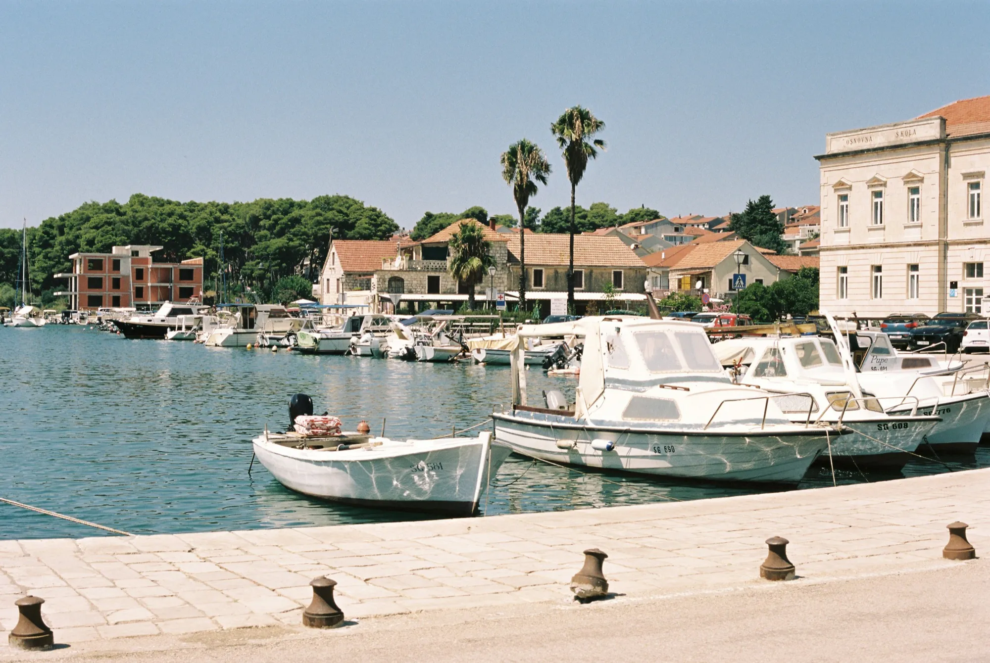 Boats moored along the waterfront promenade of Stari Grad harbour, Hvar island Croatia — photo by Lawrence Krowdeed