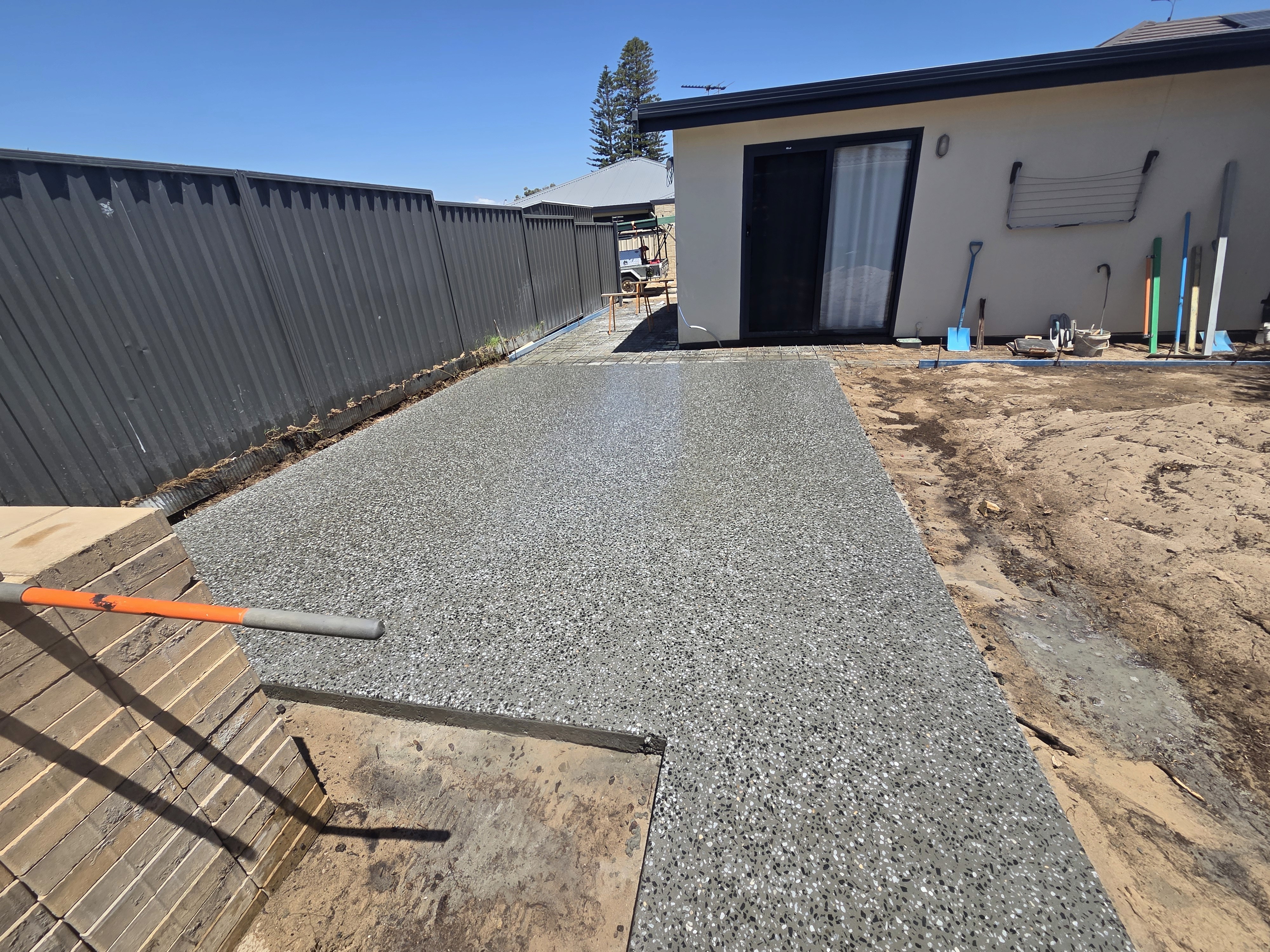 Rachel, personal trainer, looking to the side confidently in a fitness studio