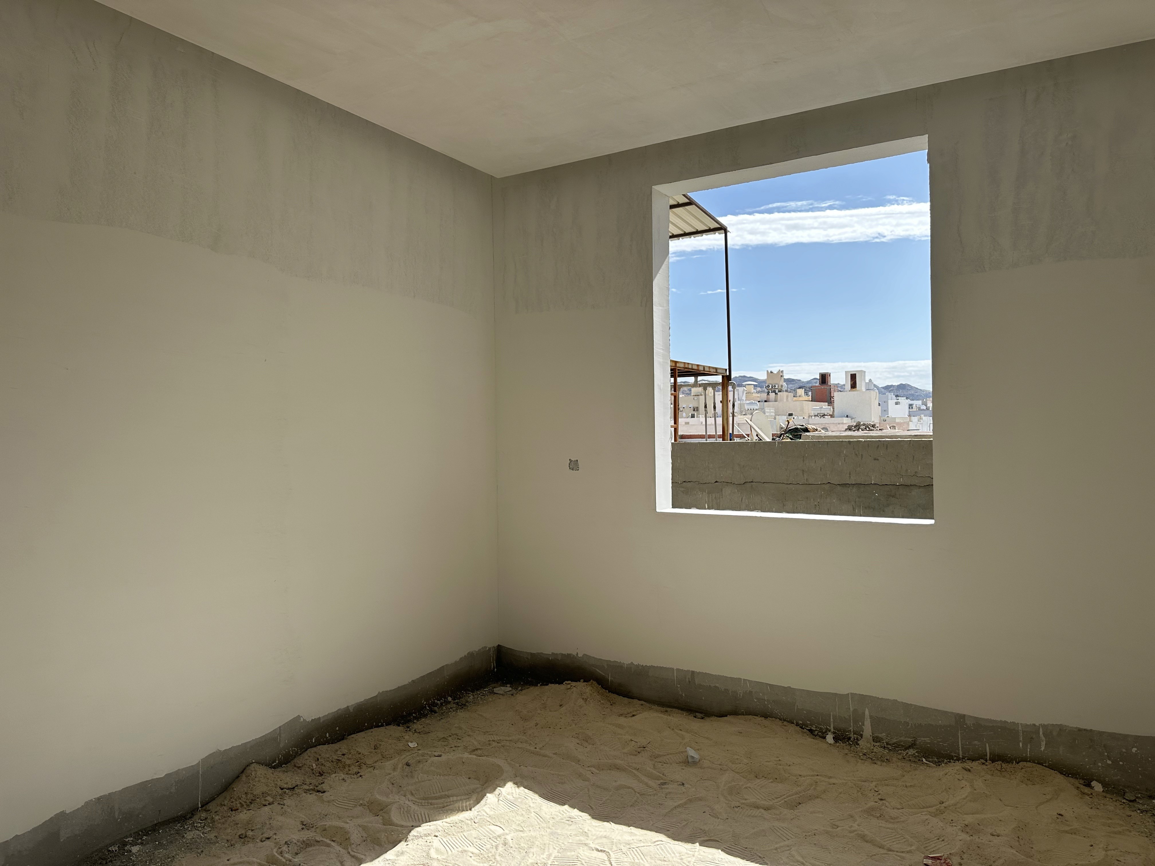 A large room with windows and a ladder