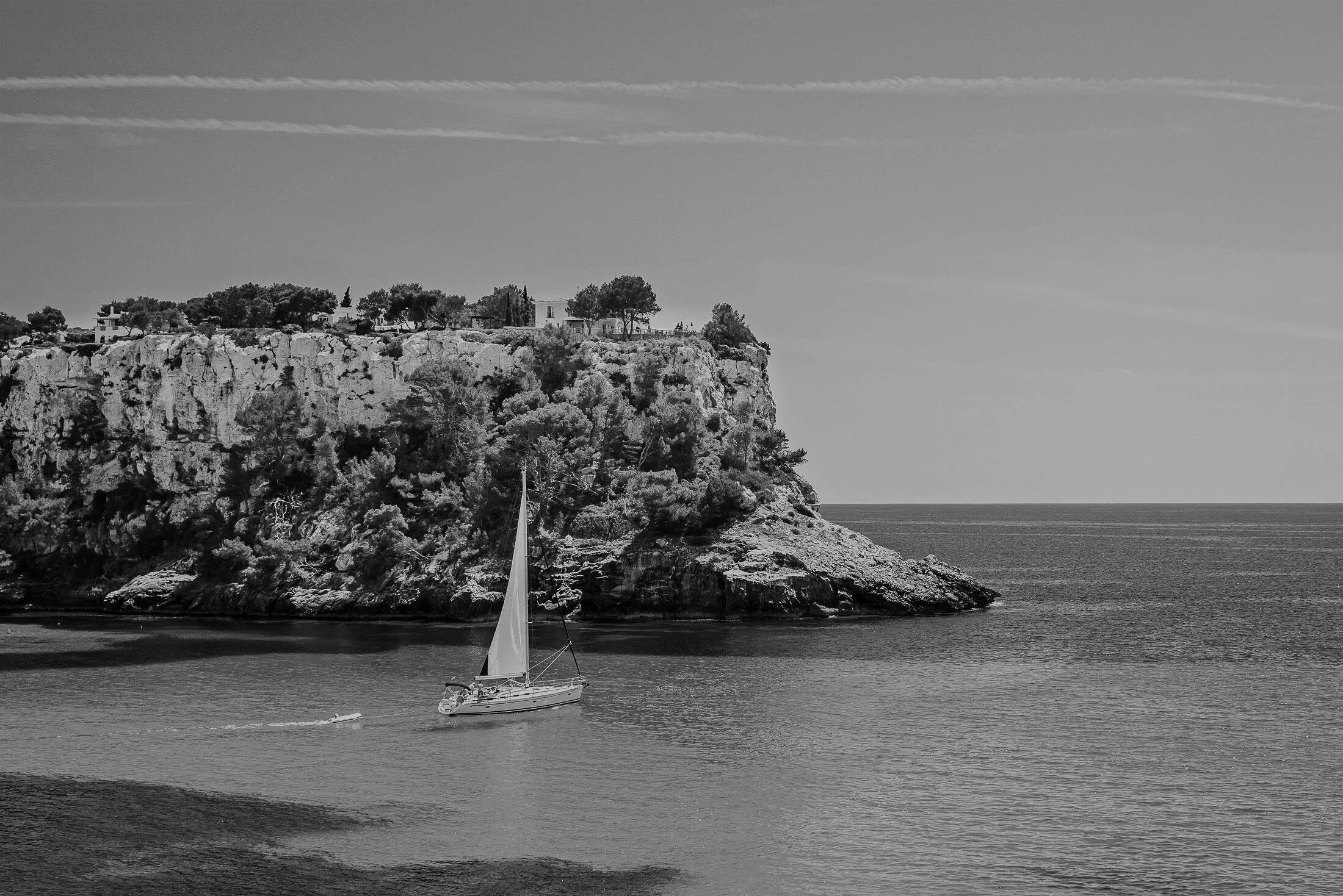 Boat in front of the coast of Corsica