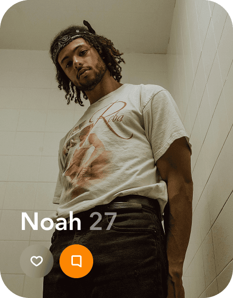 a profile photo of a young man in a white tee shirt taken from below