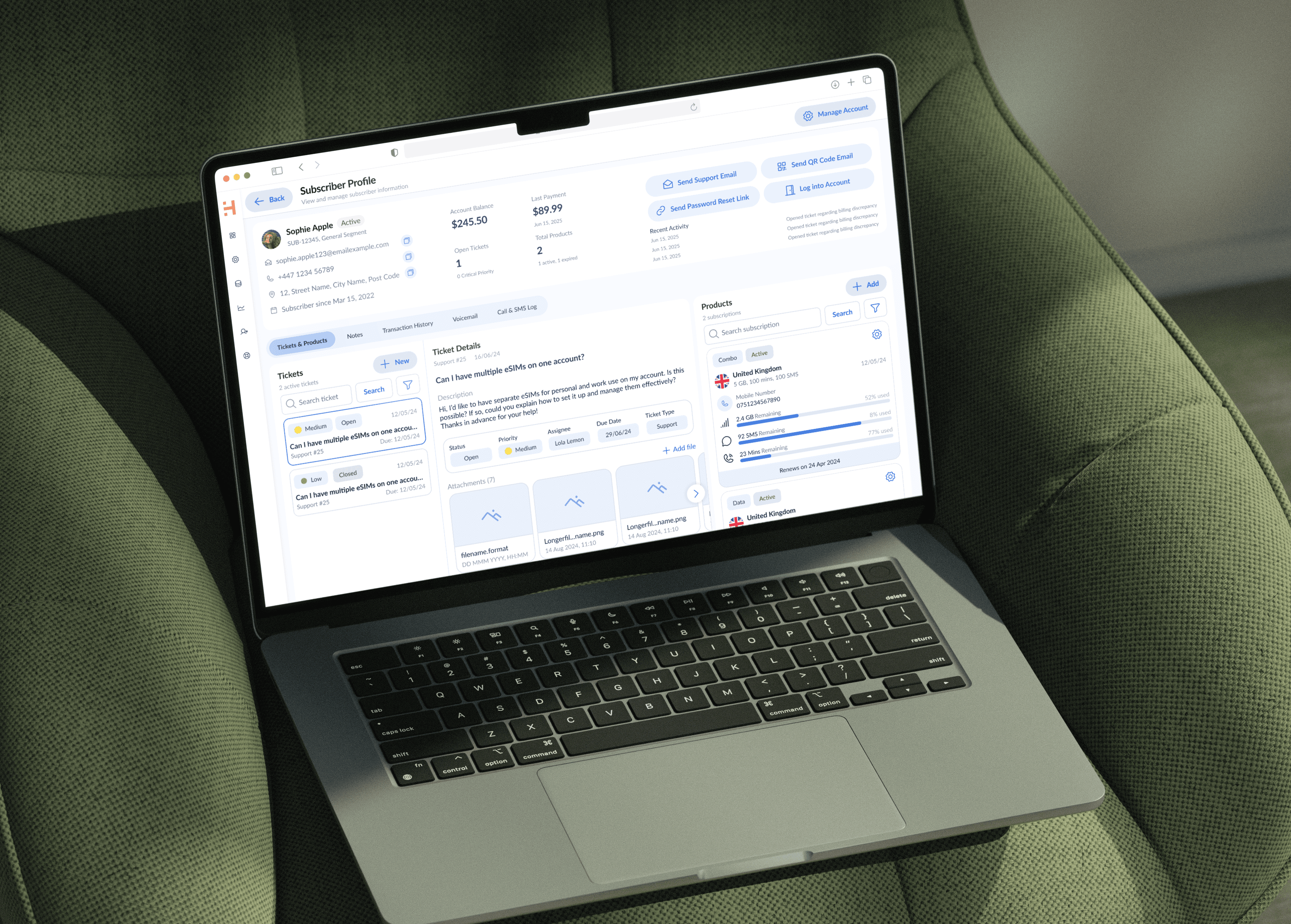 Laptop displaying the redesigned HERO CRM interface with customer profile and analytics panels.