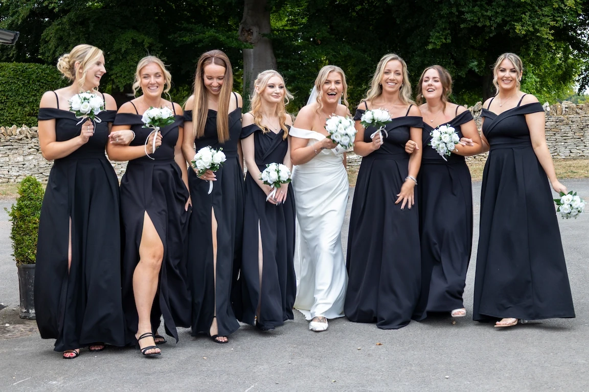 Charlotte with her bridesmaids at The Great Barn Aynho in Oxfordshire