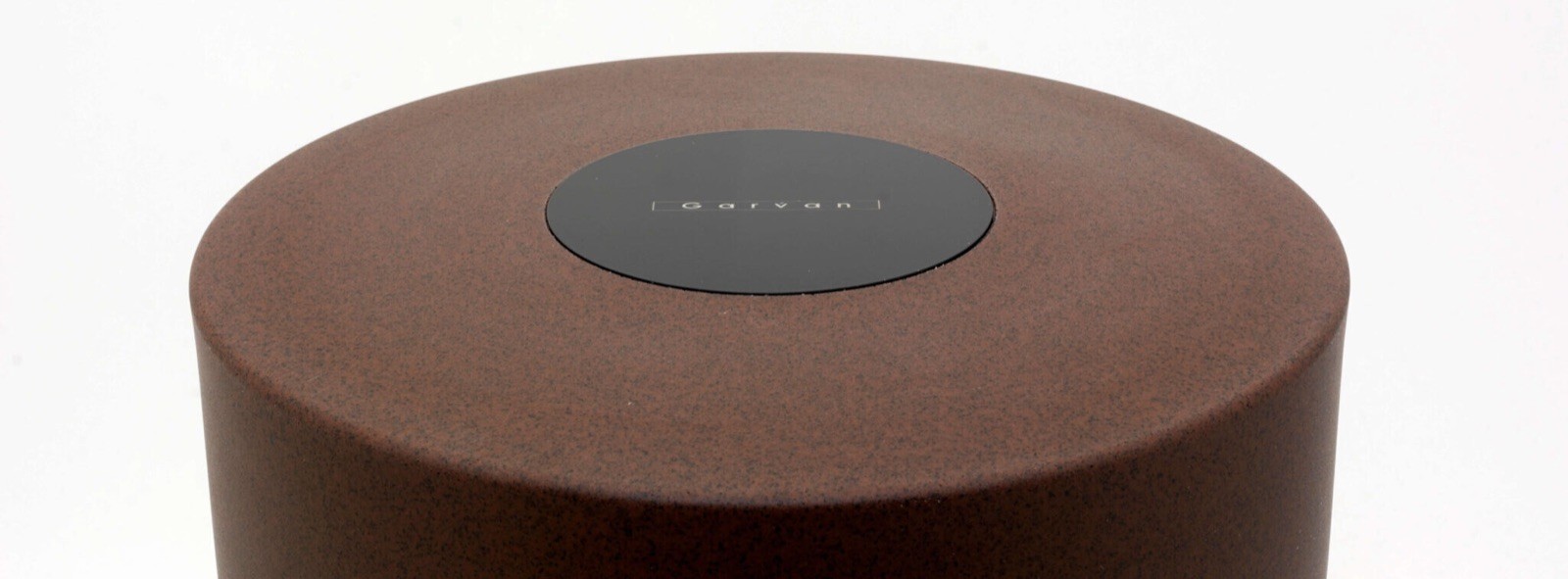 Black smart home device with screen showing time and temp